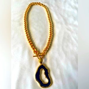 New black pendant designed gold chain necklace .